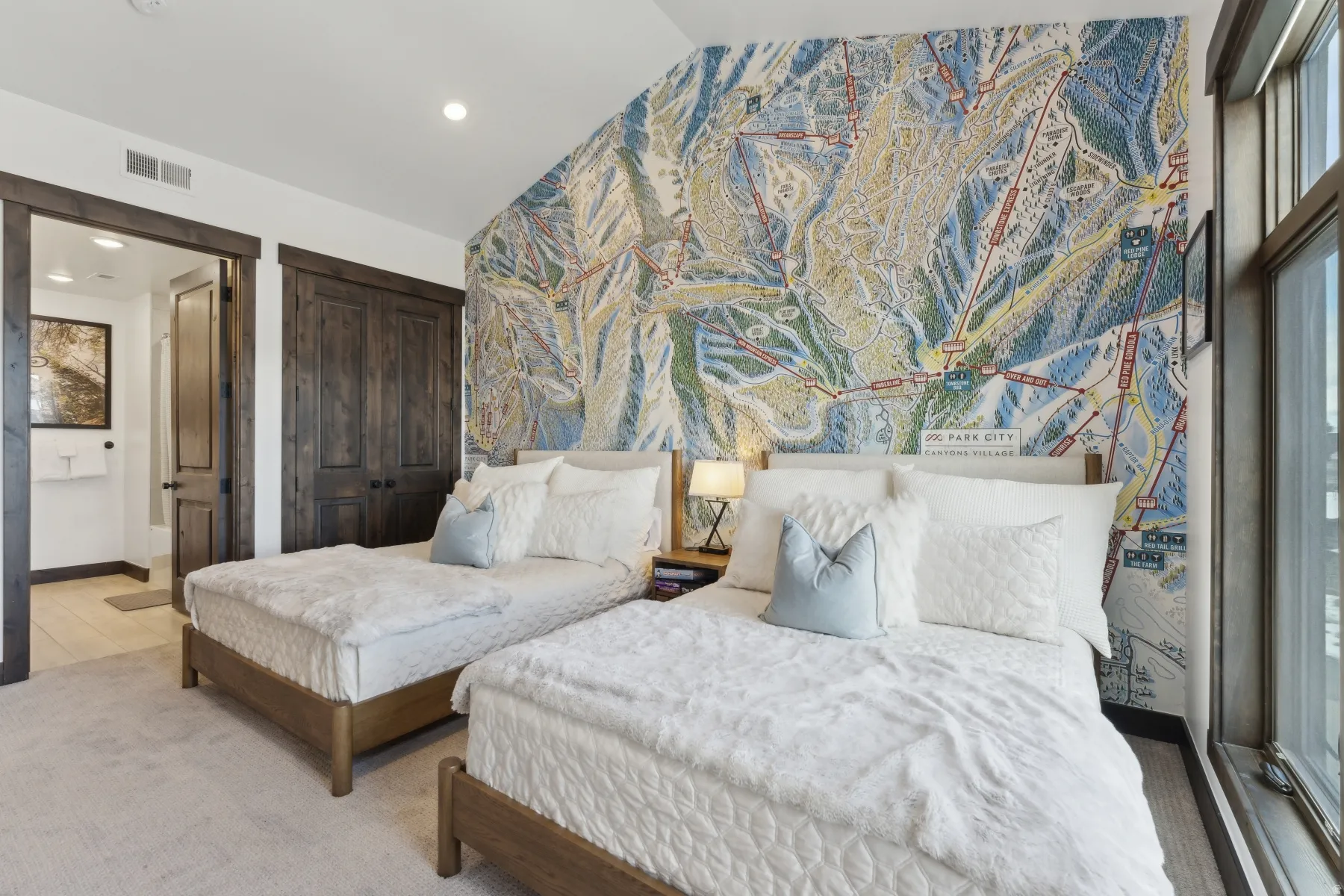 Bedroom featuring vaulted ceiling, an accent wall, a closet, and recessed lighting