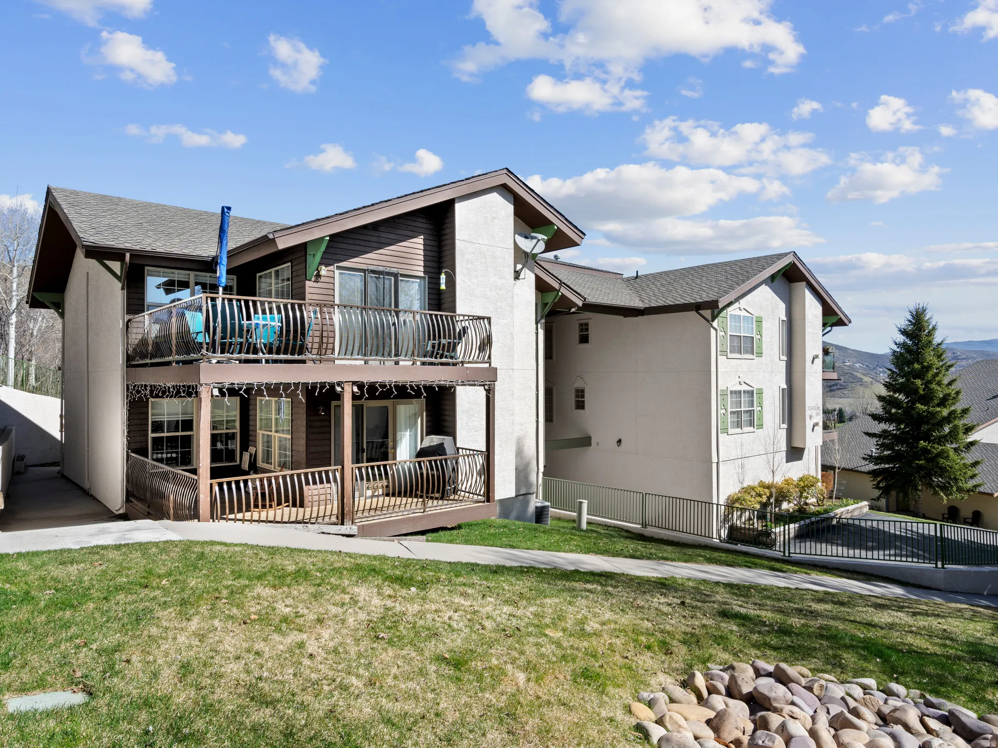 Back of house featuring a patio area and a deck