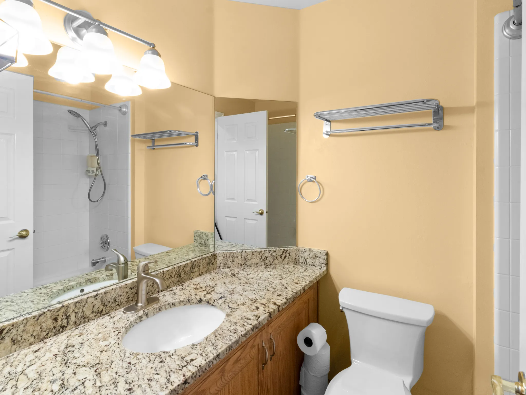 Bathroom with vanity and tub / shower combination