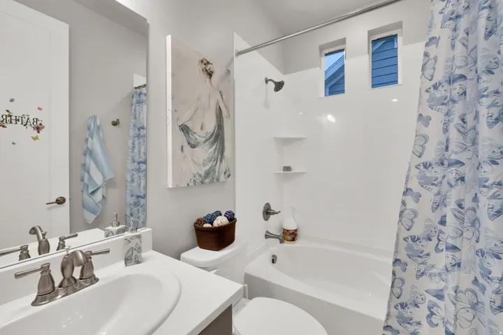 Full bathroom with vanity and shower / bath combination with curtain