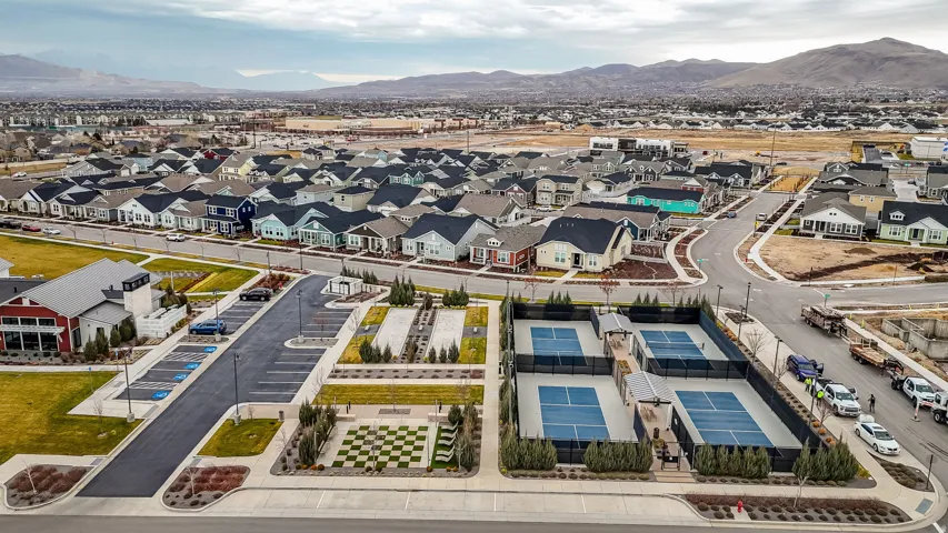 Aerial view of residential area featuring a mountainous background