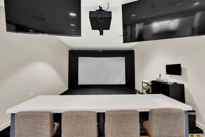 Office featuring baseboards and golf simulator