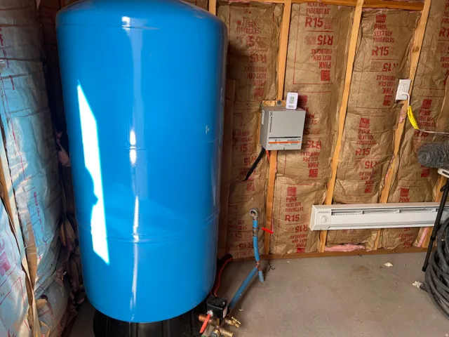 Well house with expansion tank
