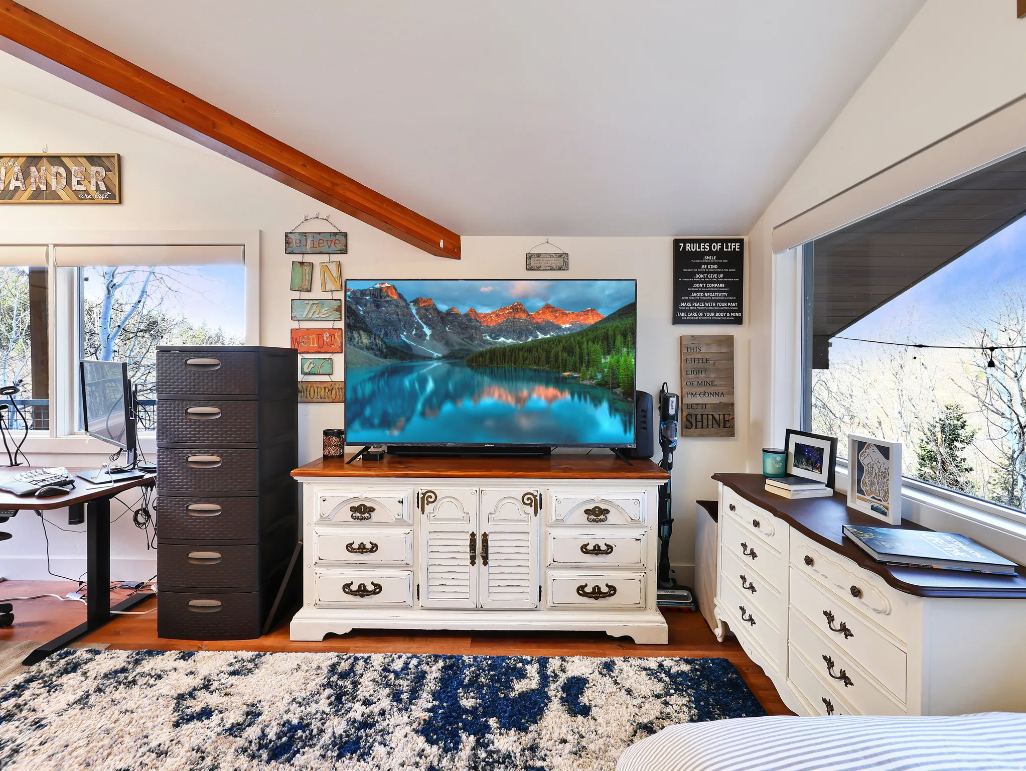 Living area with plenty of natural light and dark wood finished floors