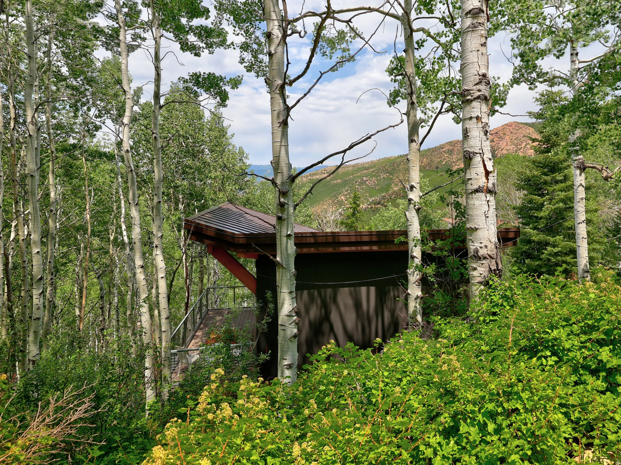 View of outdoor structure featuring a view of trees