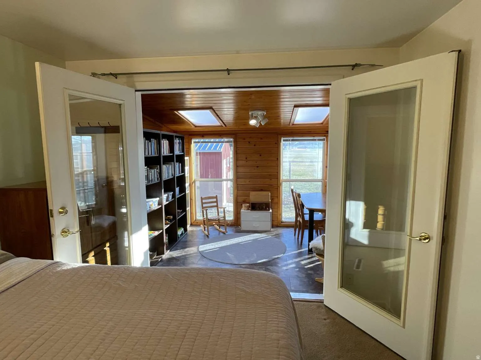 Bedroom with wood walls