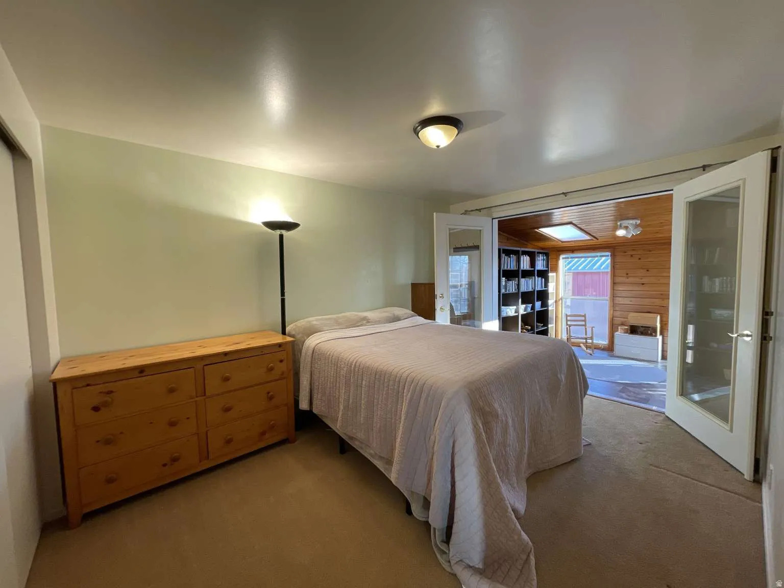 Bedroom with carpet flooring and french doors