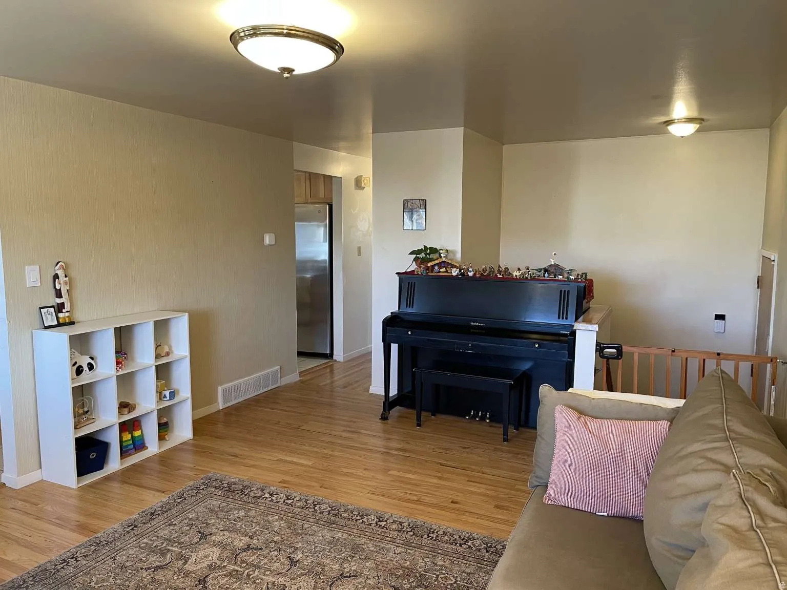 Sitting room featuring light wood-style flooring and baseboards