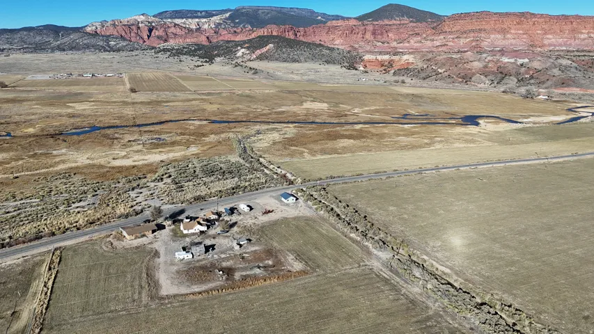 Aerial view of property's location featuring rural landscape and mountains