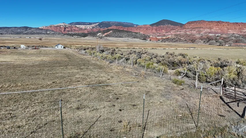 View of mountain backdrop with rural landscape