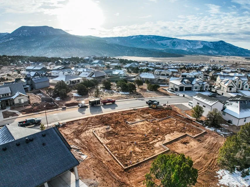Aerial view of residential area featuring mountains