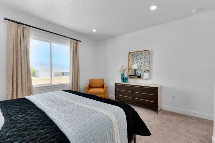 Bedroom with carpet and a mountain view