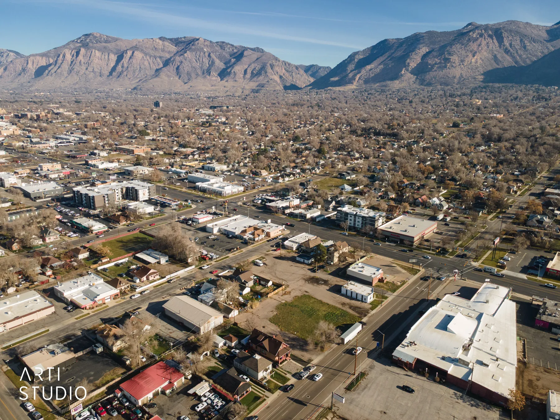 Aerial overview of property's location with a mountainous background