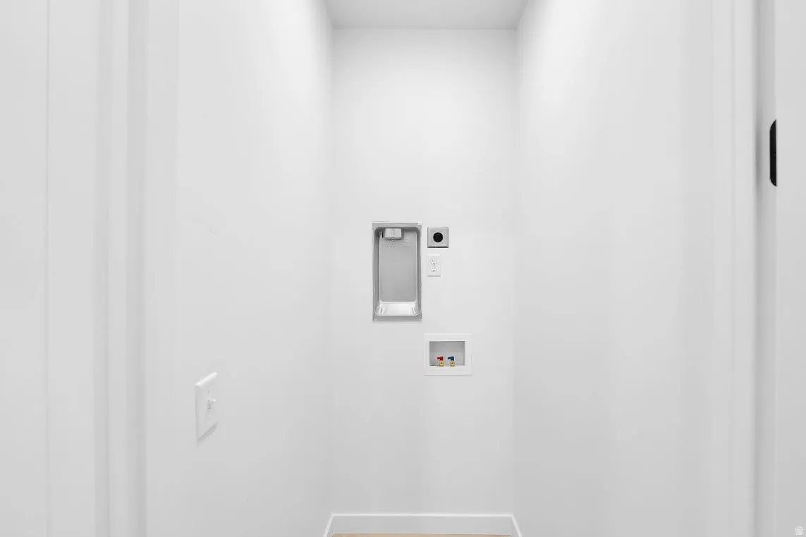 Laundry area with hookup for a washing machine and hookup for an electric dryer