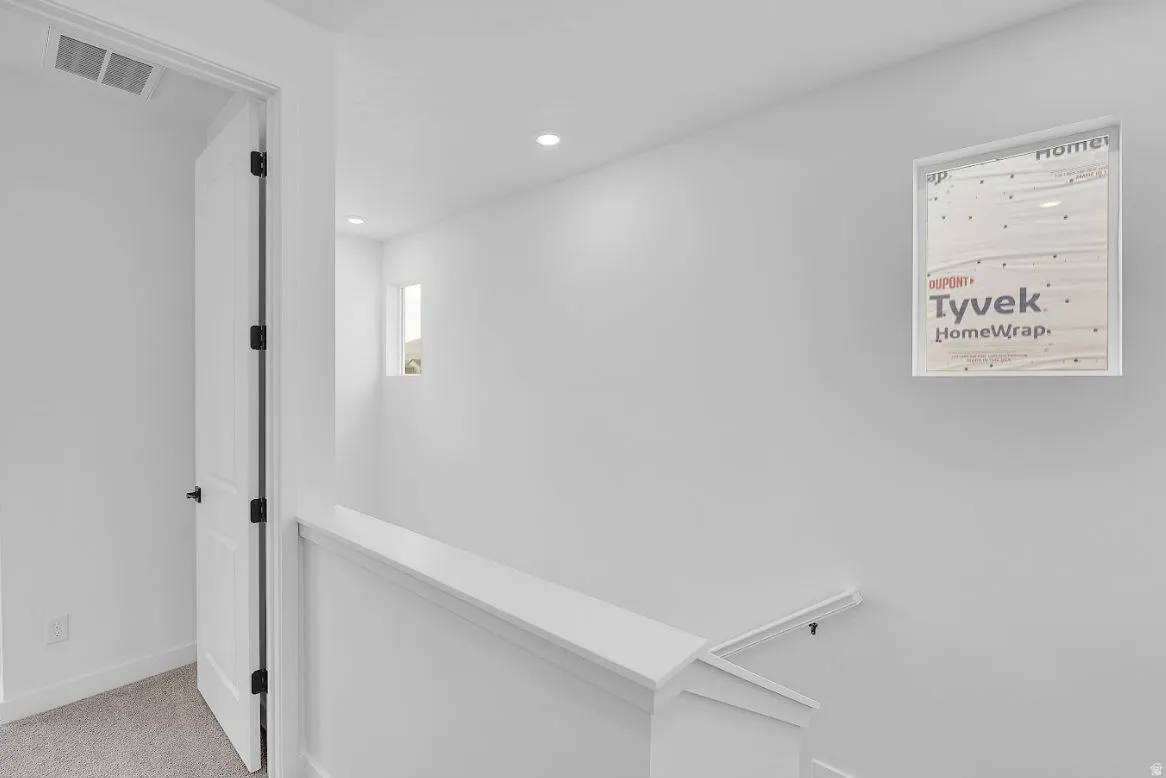 Hall featuring carpet floors and recessed lighting