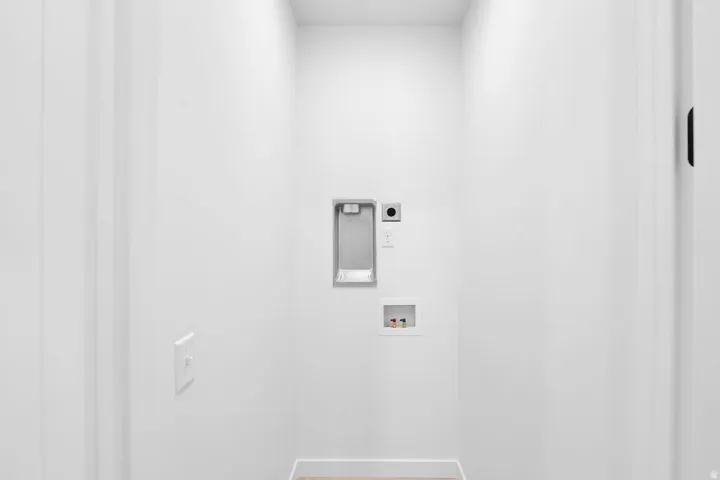 Laundry area with hookup for a washing machine and hookup for an electric dryer