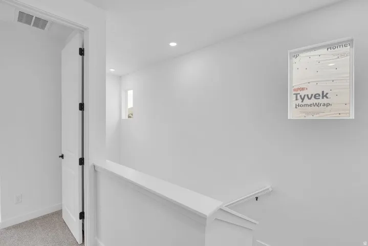 Hall featuring carpet floors and recessed lighting