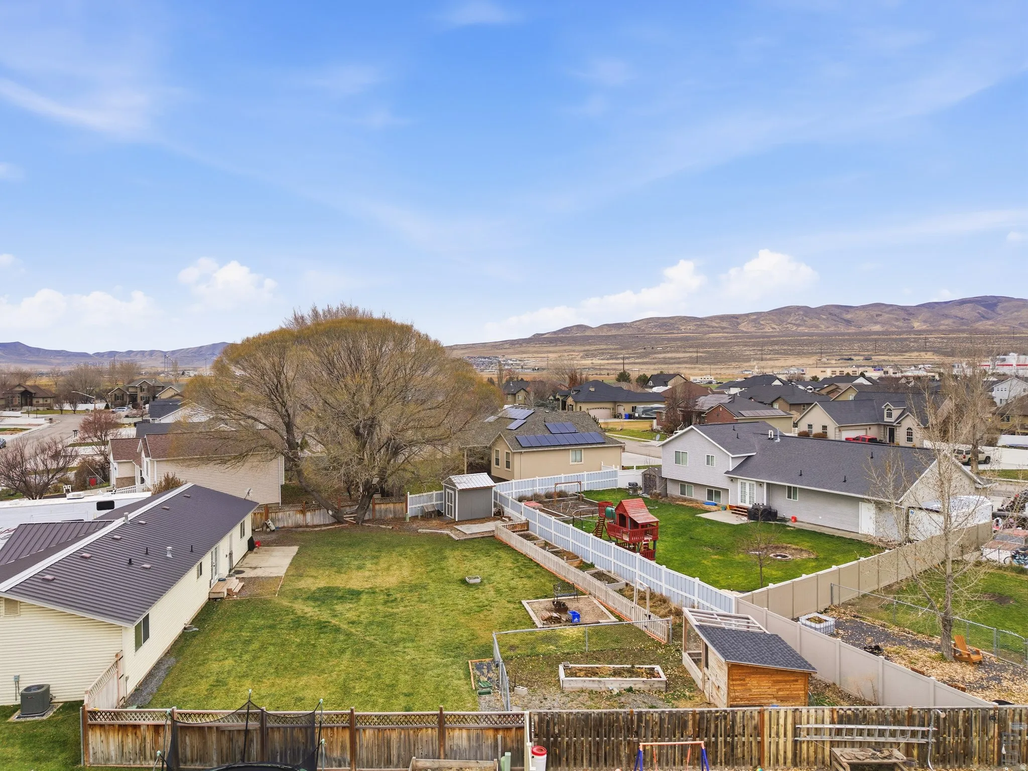 Aerial perspective of suburban area featuring mountains