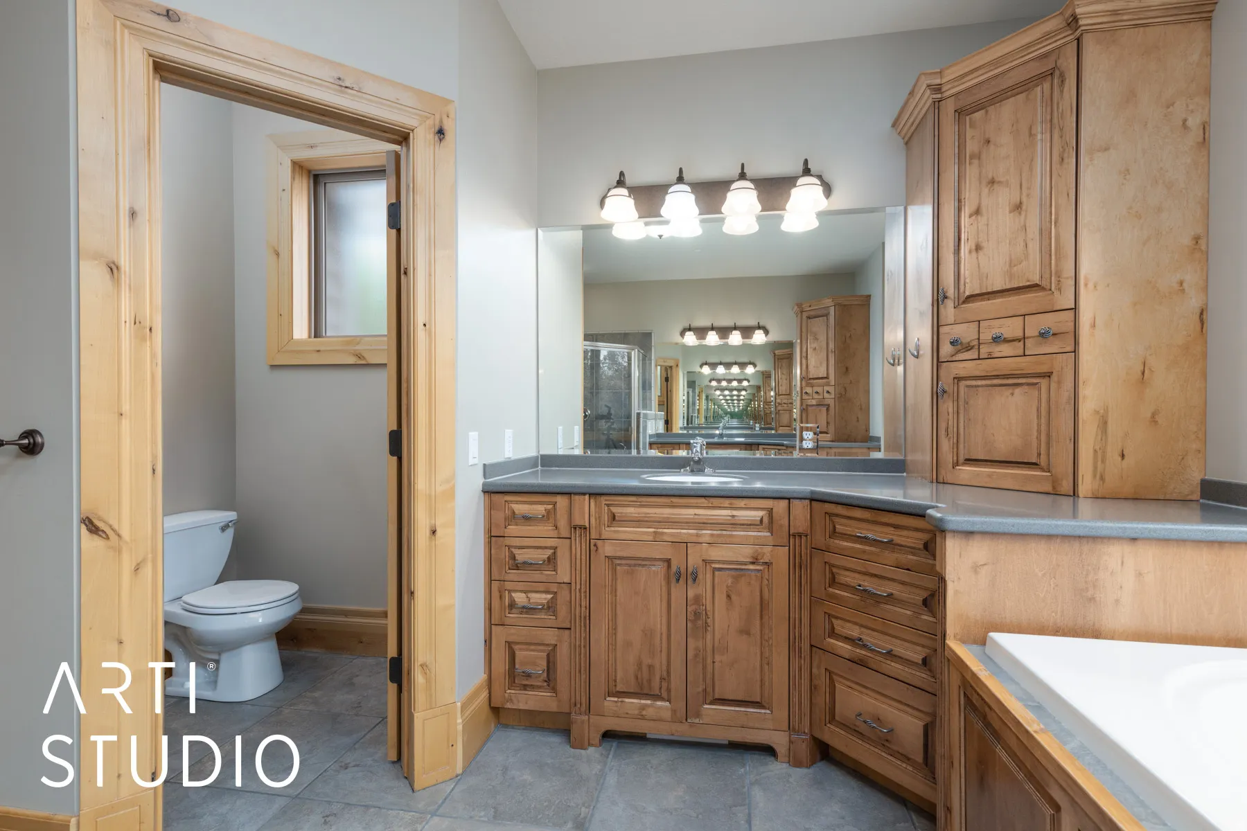 Full bathroom with vanity and a stall shower