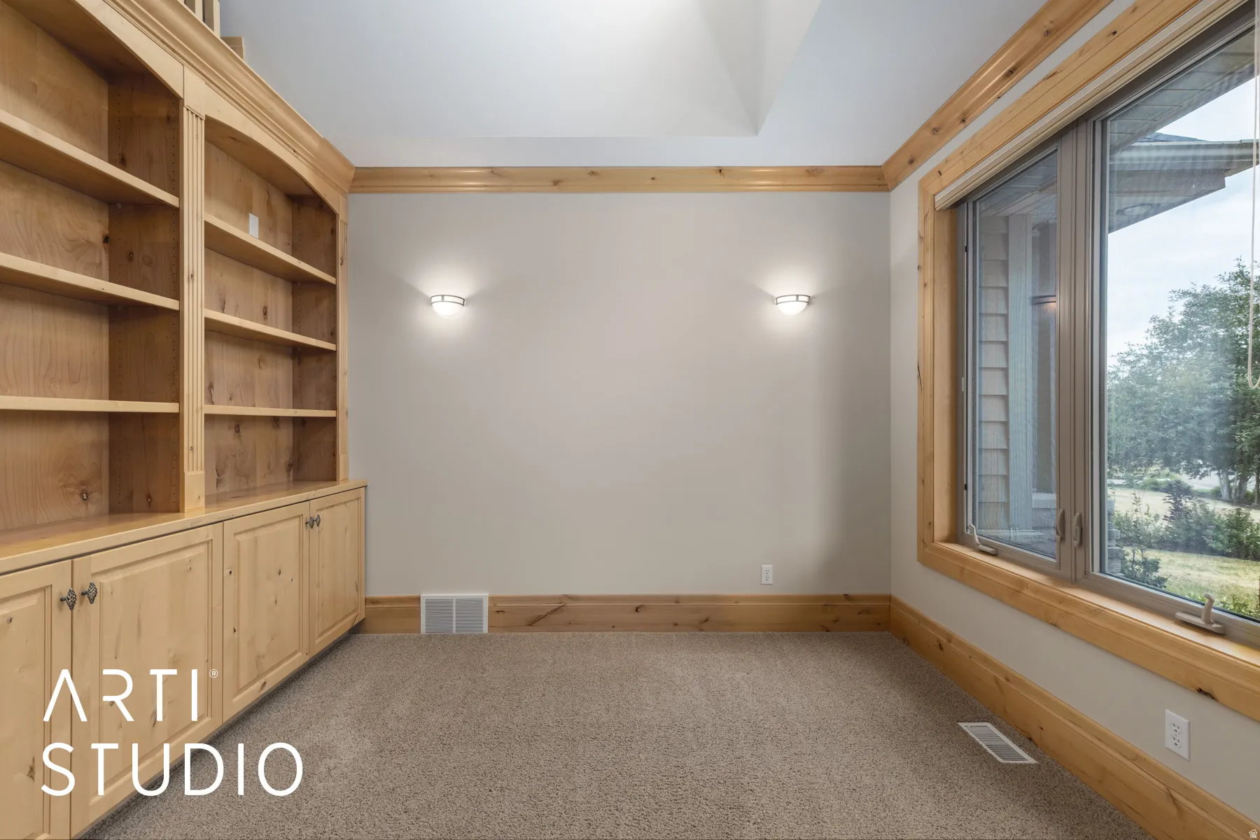 Spare room featuring light carpet and crown molding