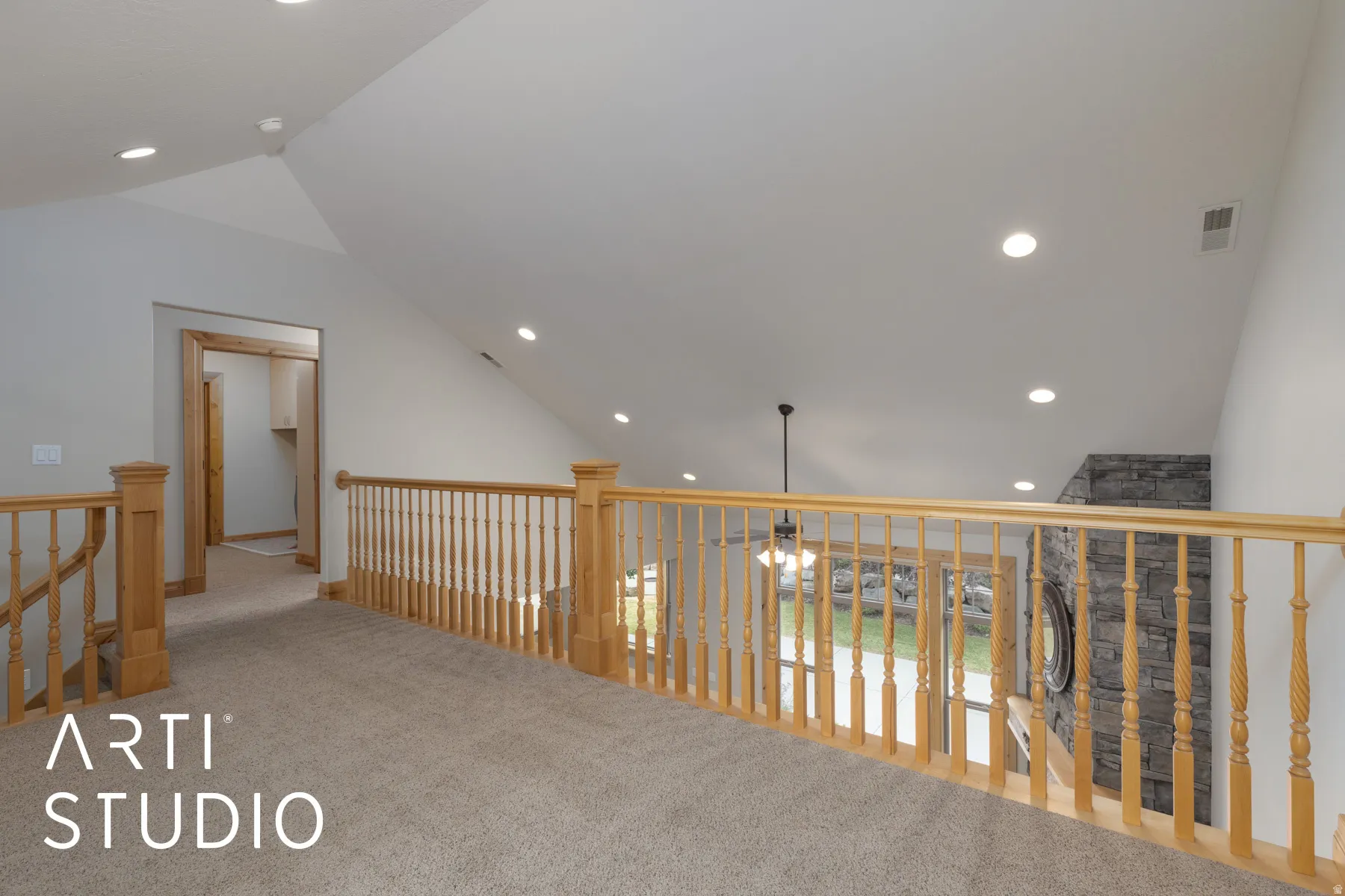 Corridor featuring recessed lighting, carpet floors, vaulted ceiling, and an upstairs landing