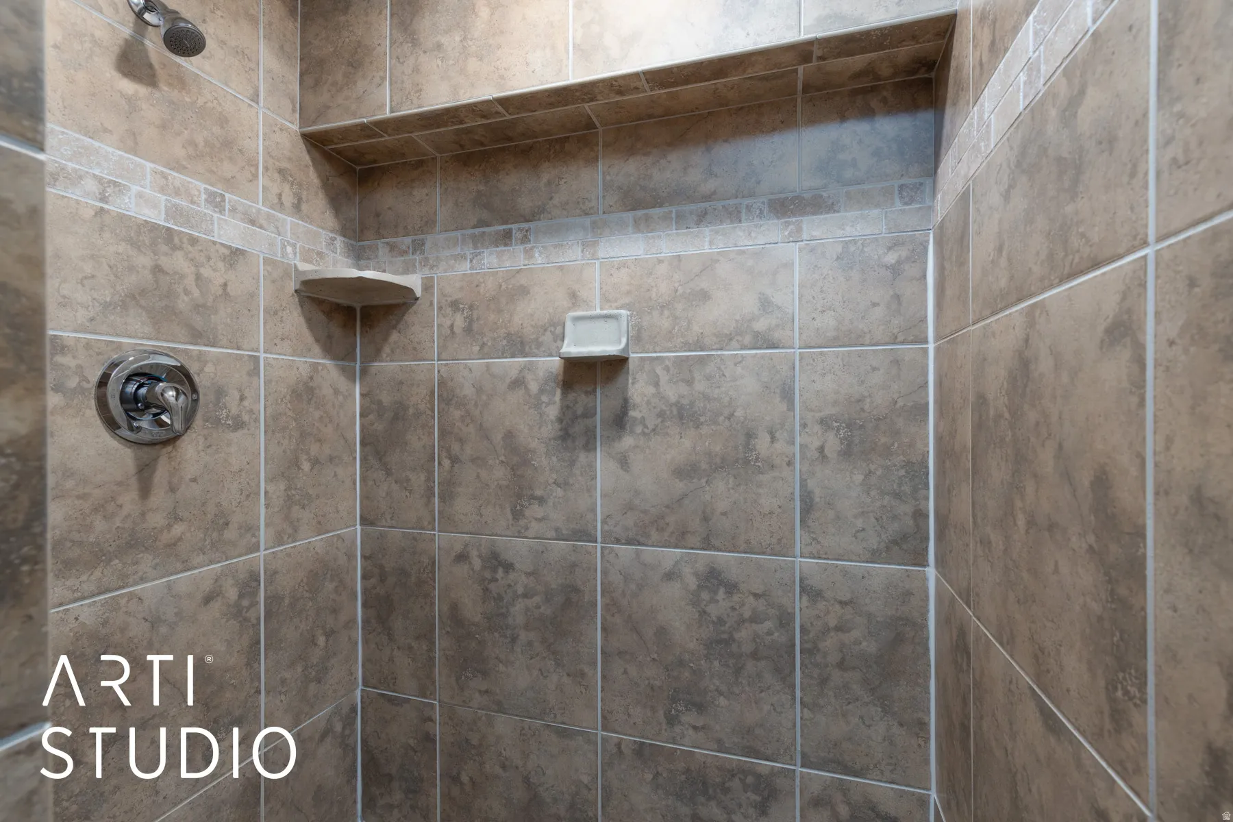 Bathroom view of a tile shower