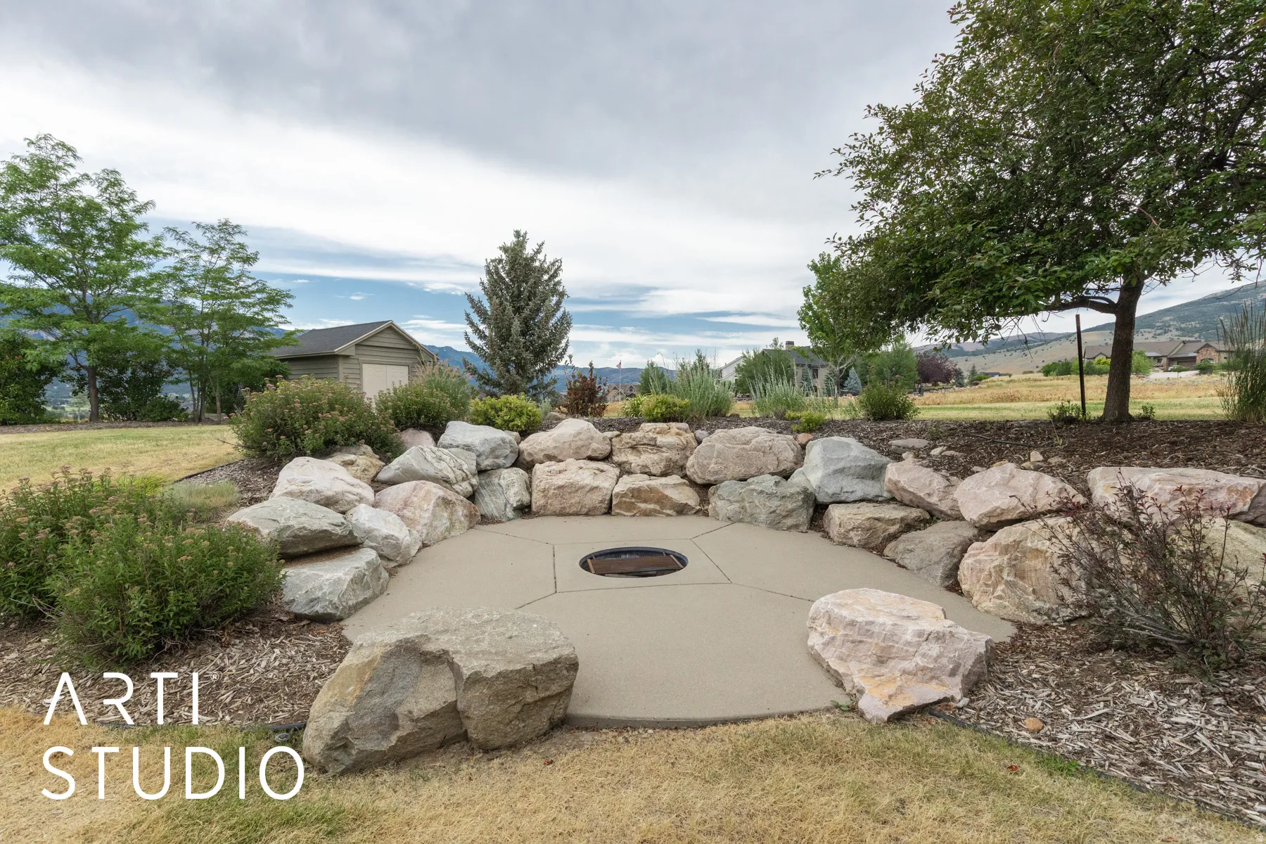 View of yard with a fire pit and a patio area