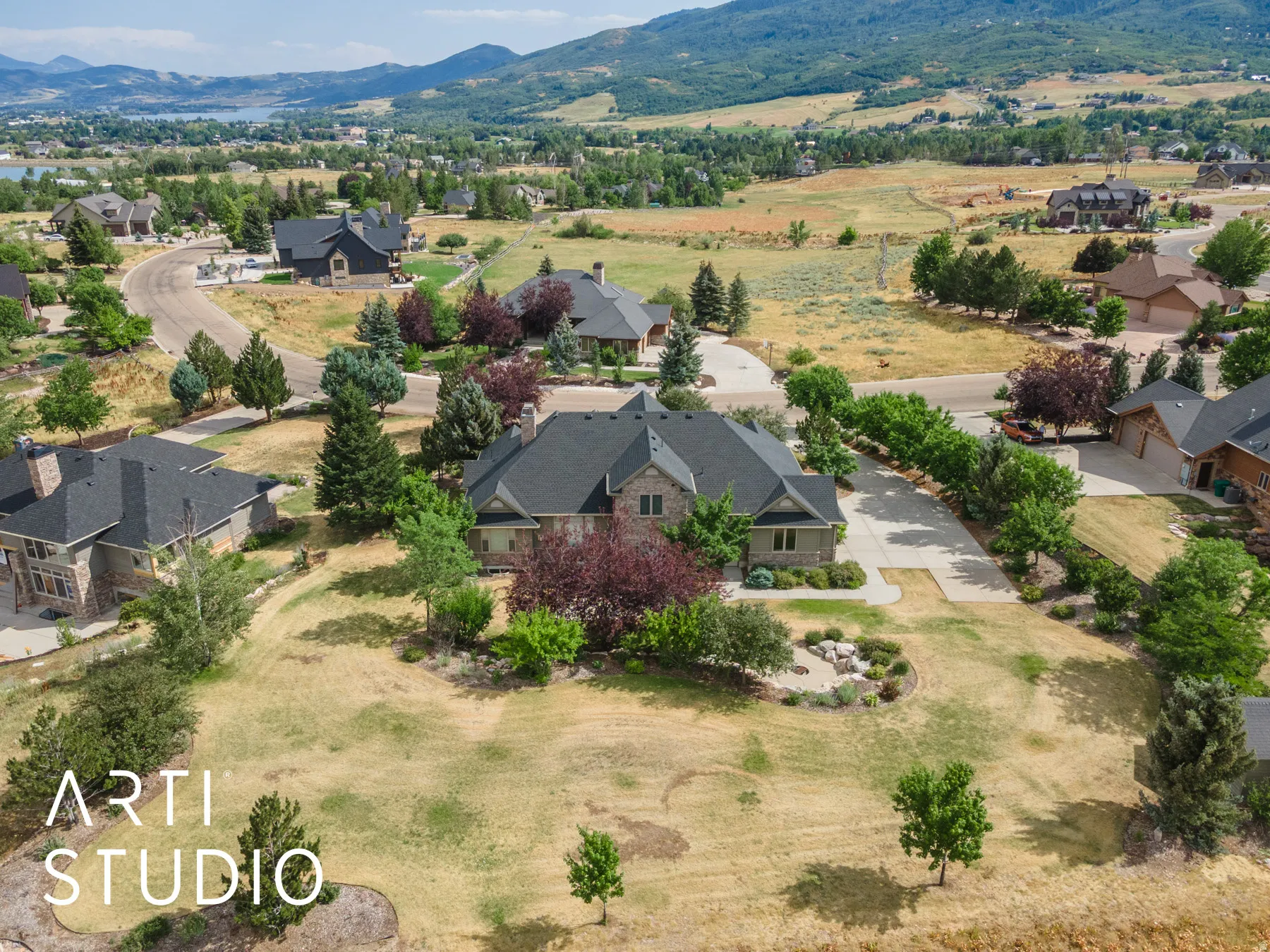 Aerial view of residential area featuring a mountain backdrop