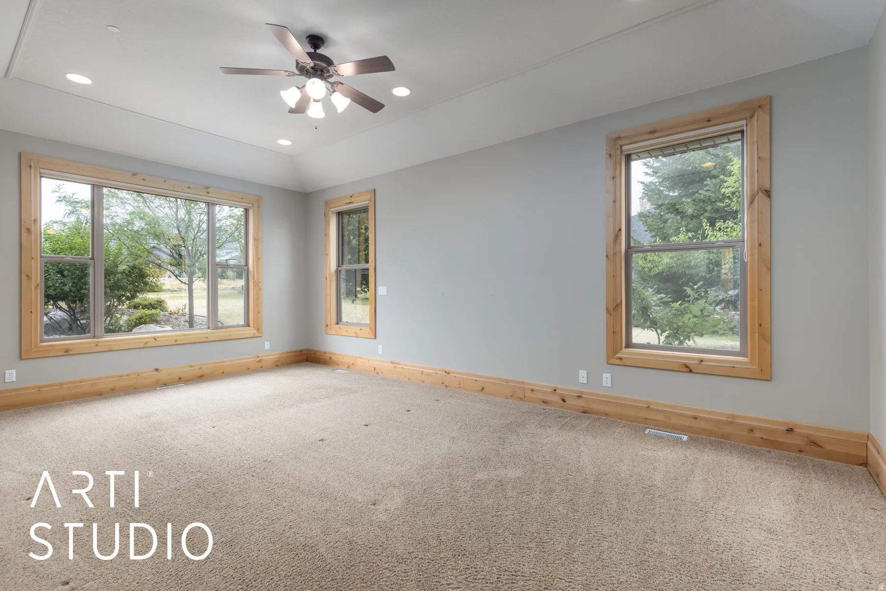 Carpeted empty room featuring recessed lighting, lofted ceiling, and ceiling fan