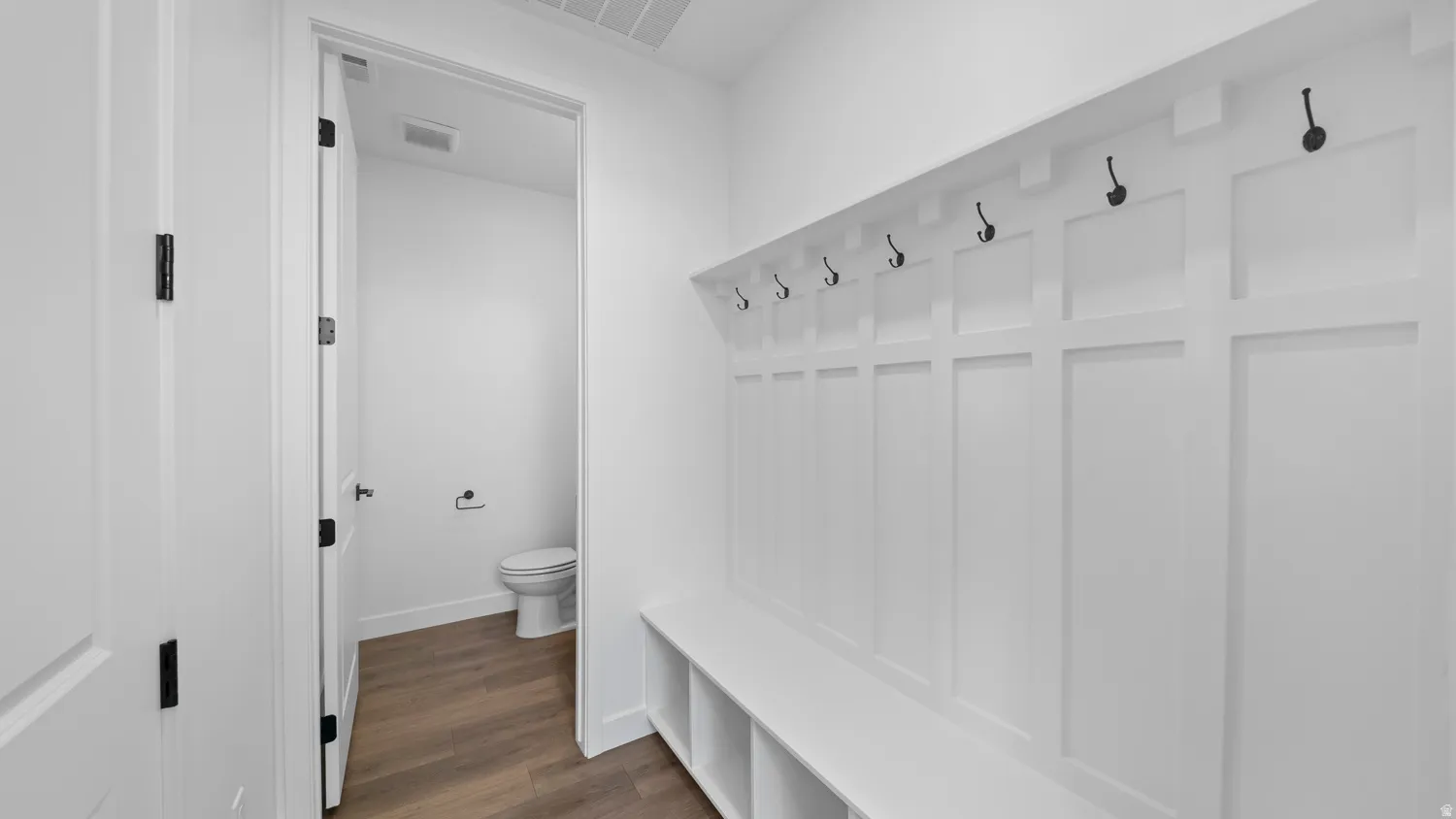 Mudroom featuring dark wood-style flooring