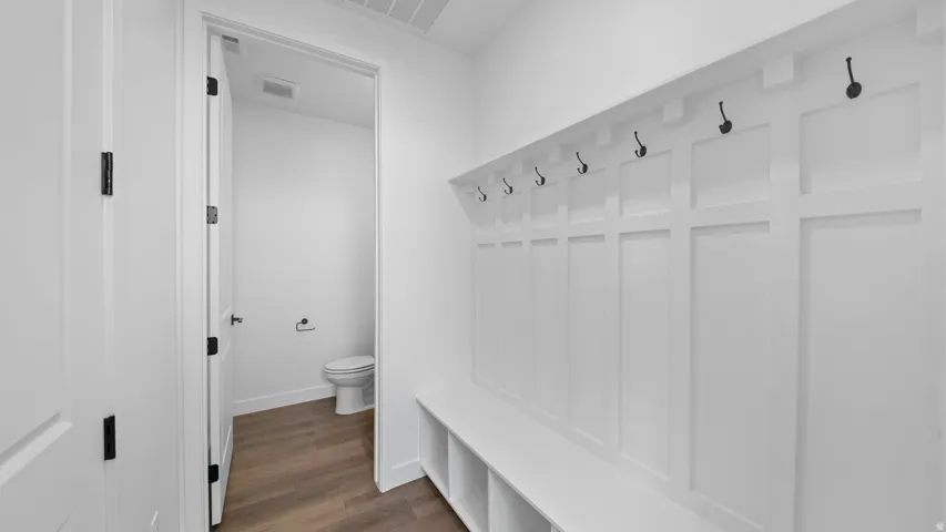 Mudroom featuring dark wood-style flooring