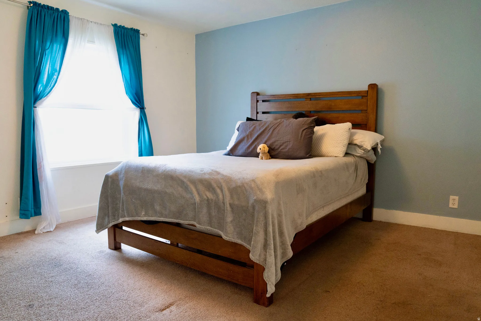 Carpeted bedroom with baseboards