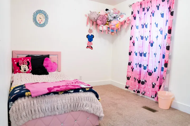 Carpeted bedroom with baseboards