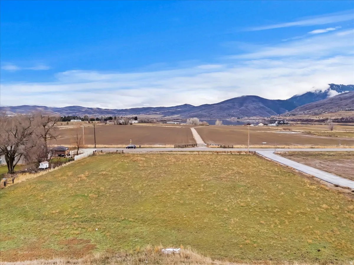 View of mountain background featuring rural landscape