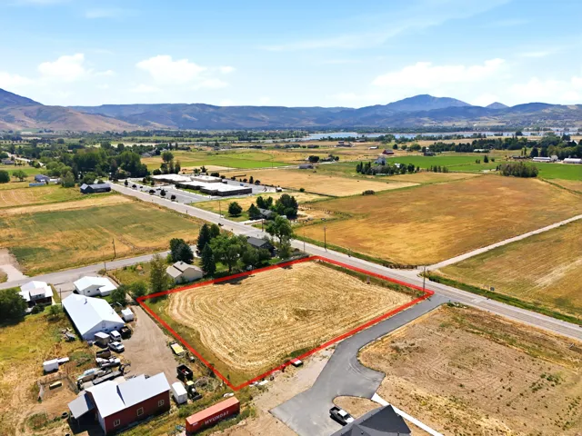 Expansive parcel featuring a cultivated field and mountainous distant scenery