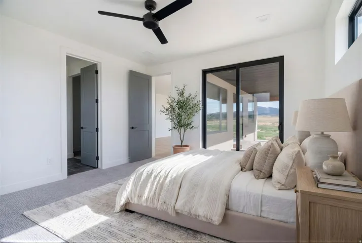 Bedroom with carpet, access to outside, and ceiling fan