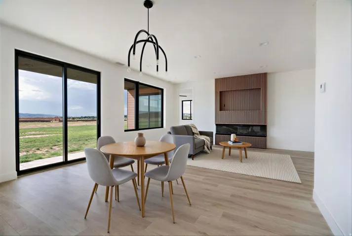 Dining area with light wood finished floors and baseboards