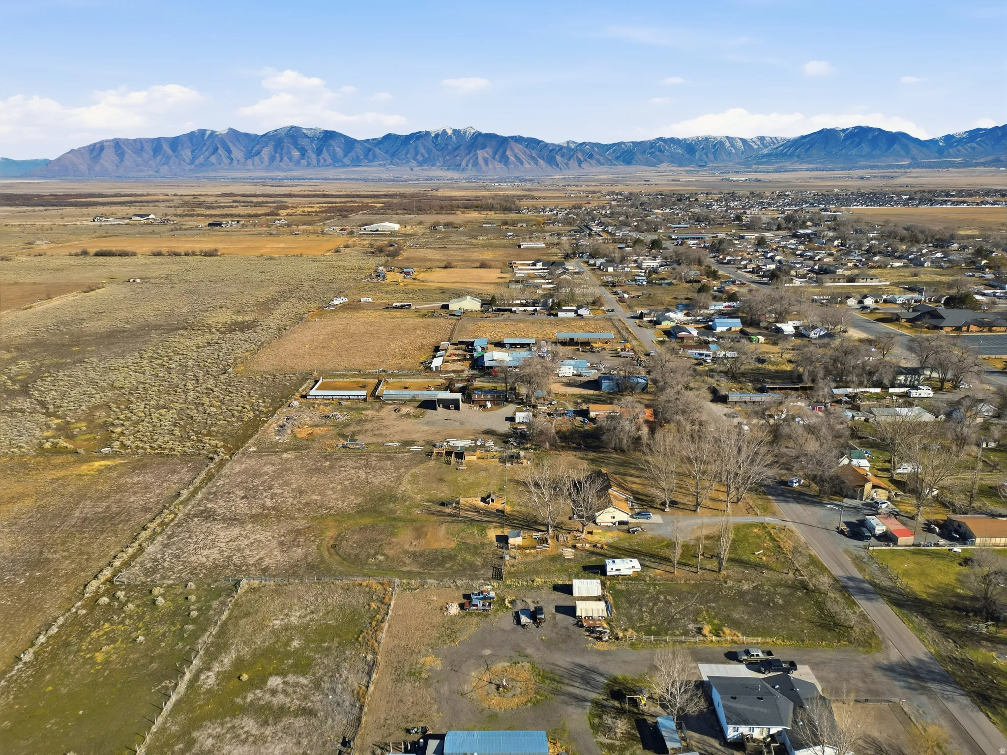 View of rural area featuring a mountain backdrop and nearby suburban area