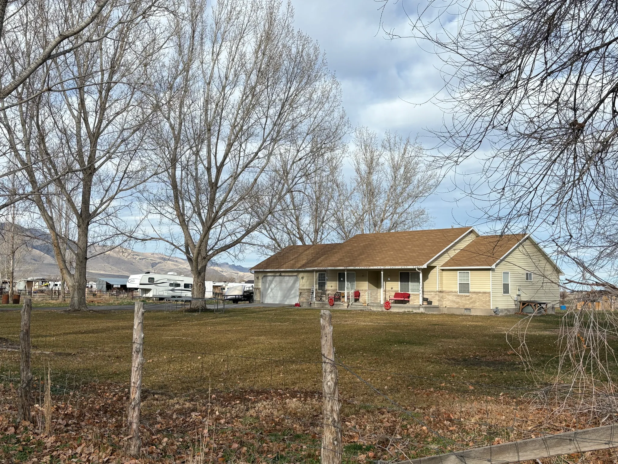 Ranch-style house with crawl space, a garage, and a porch