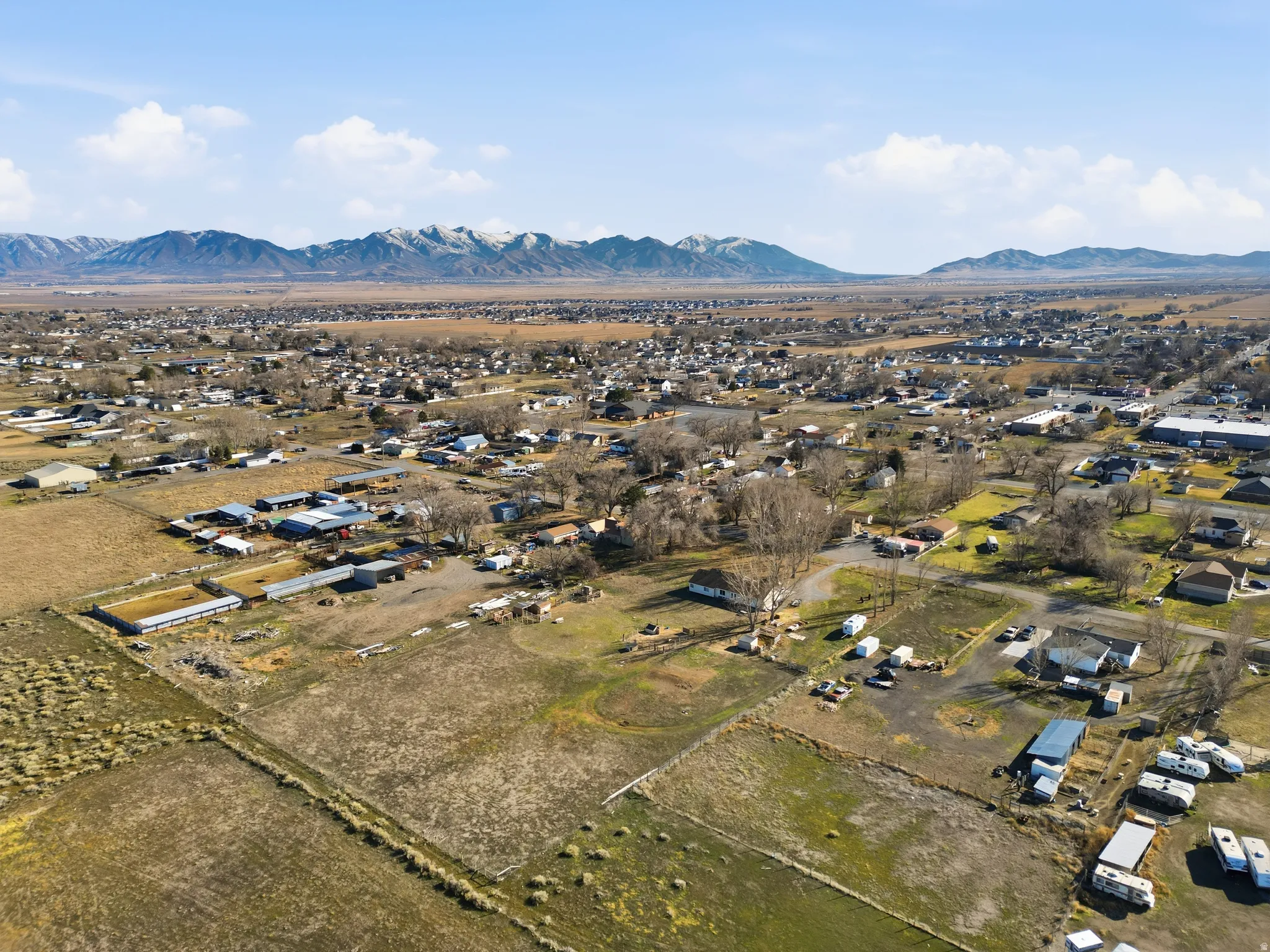 Aerial perspective of suburban area with a mountain backdrop