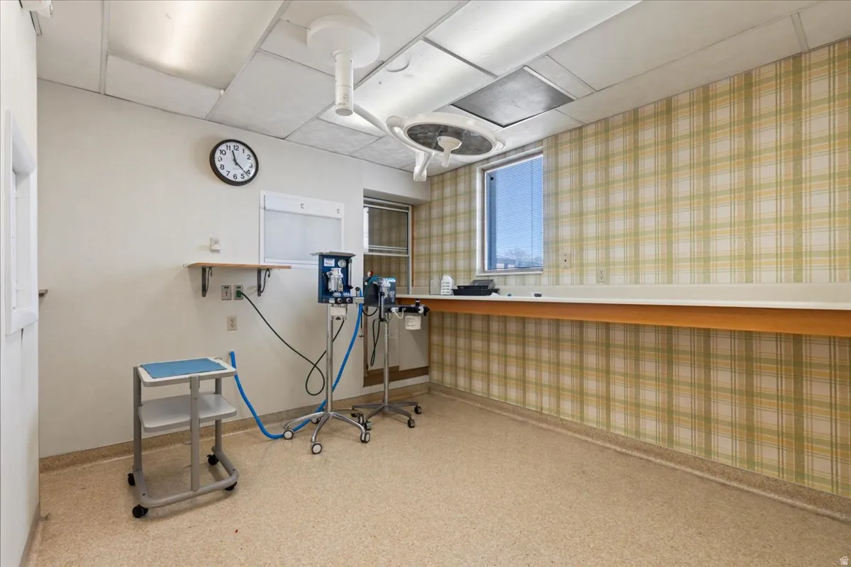 Miscellaneous room featuring wallpapered walls