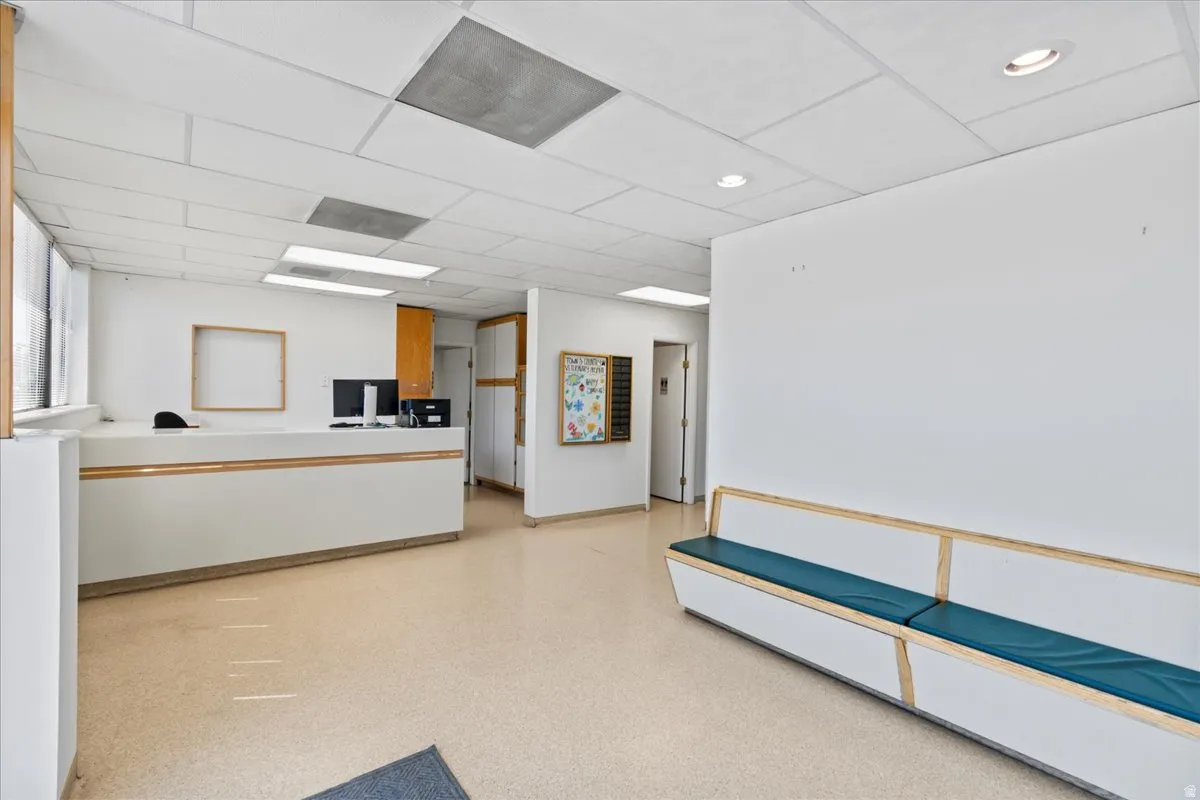 Welcome area featuring a drop ceiling