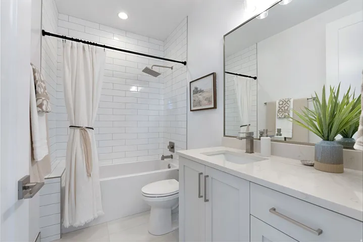Bathroom with shower / bath combination with curtain, vanity, light tile patterned floors, and recessed lighting