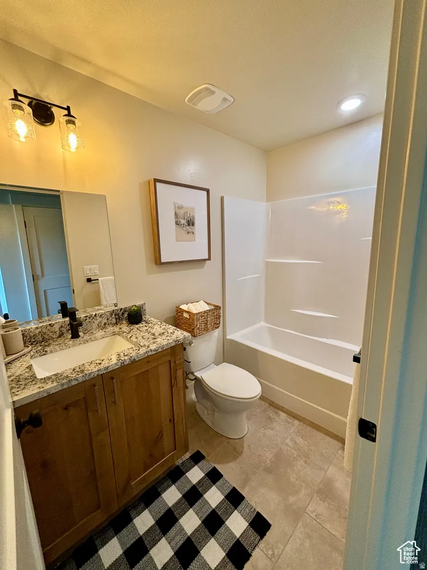 Bathroom featuring vanity and bathtub / shower combination