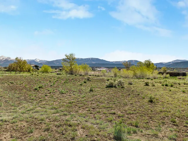 View of mountain backdrop featuring rural landscape