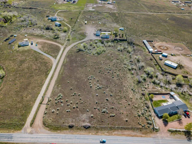 Aerial view of property and surrounding area with rural landscape