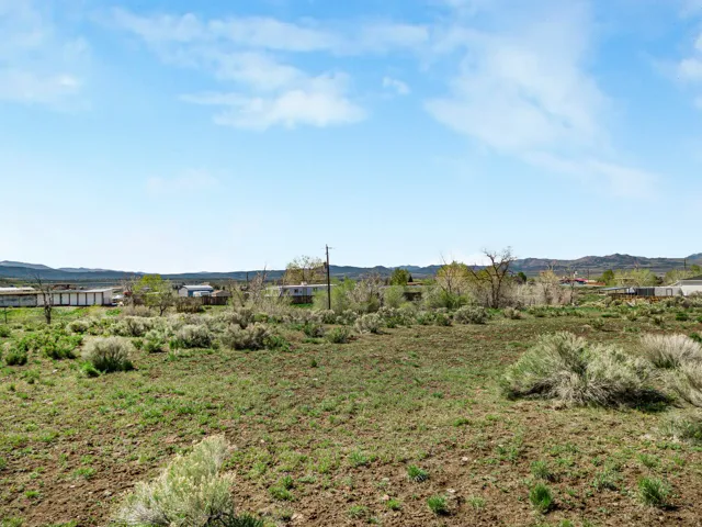 View of yard with a mountain view and a rural view