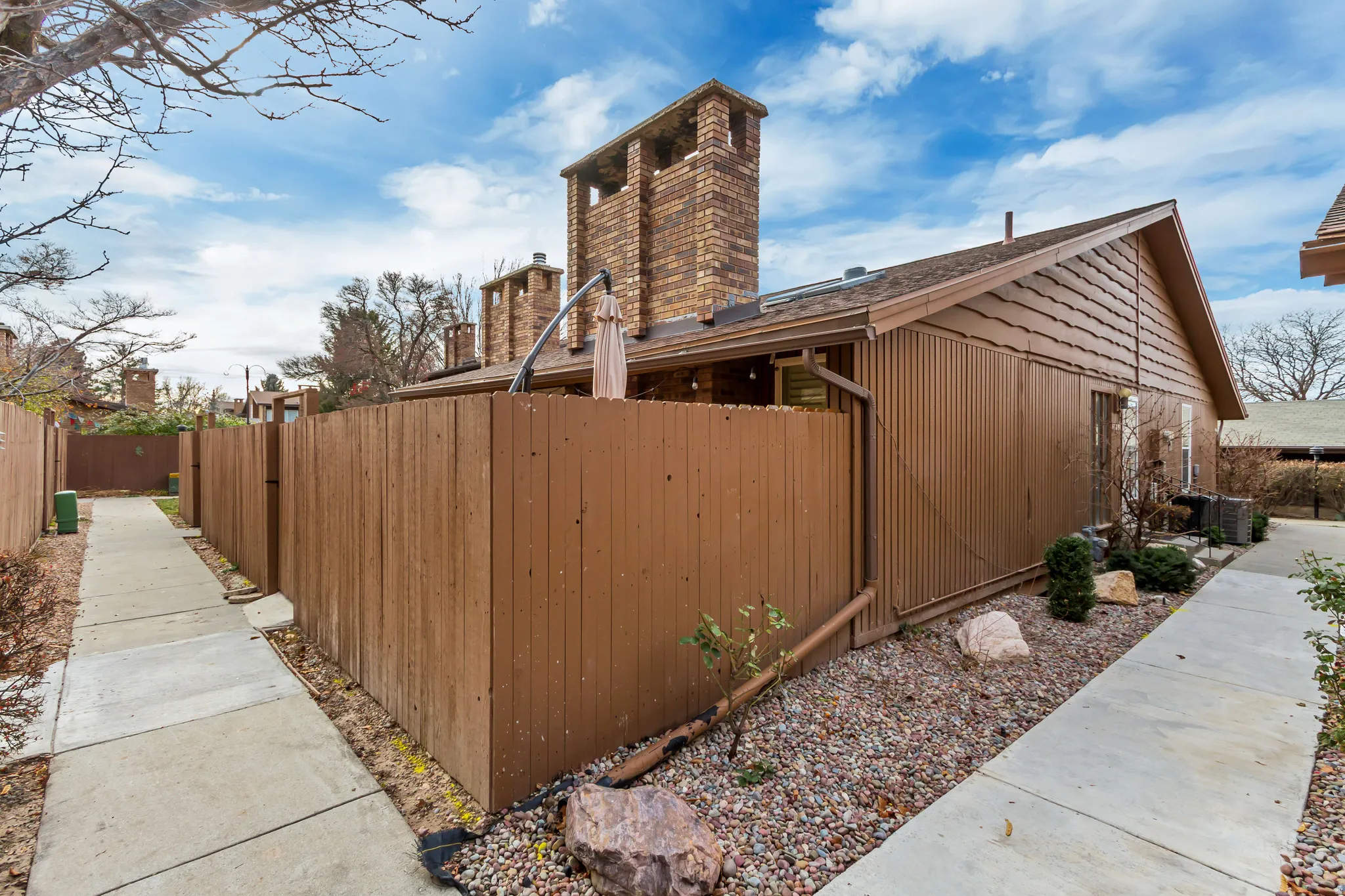 View of home's exterior with a cooling unit