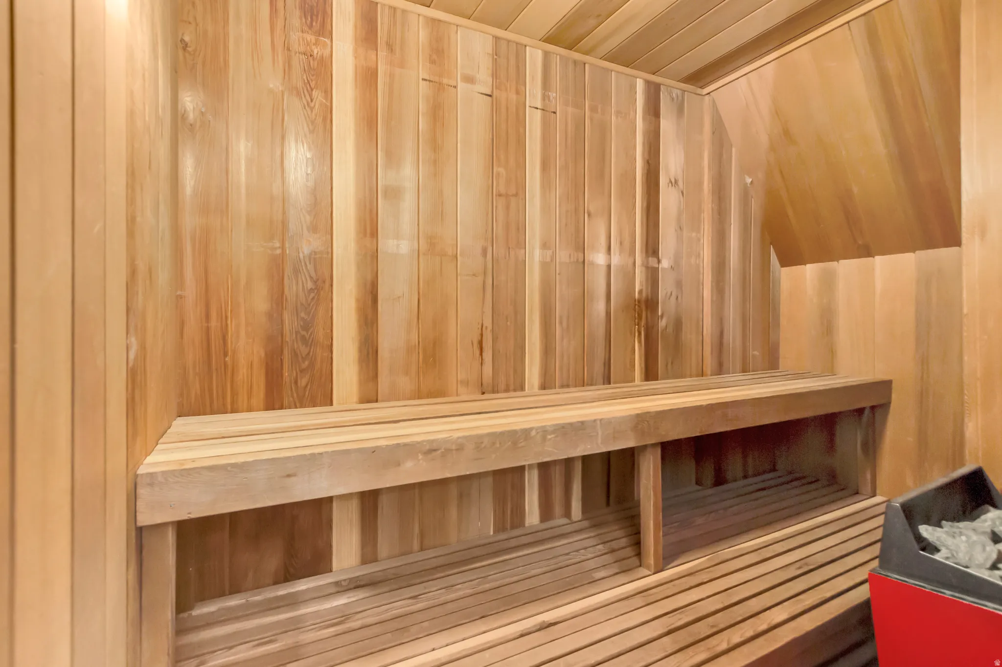 Relaxing sauna with wooden walls and wooden ceiling