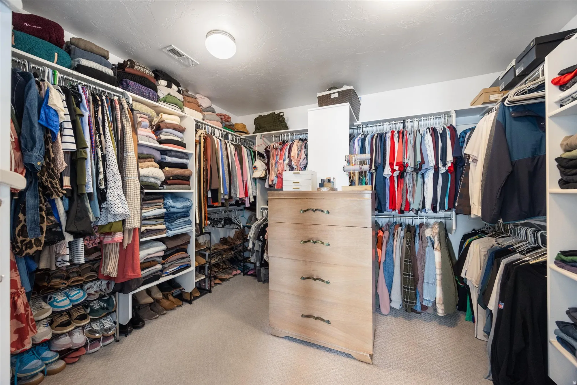 Spacious walk-in closet for primary bedroom